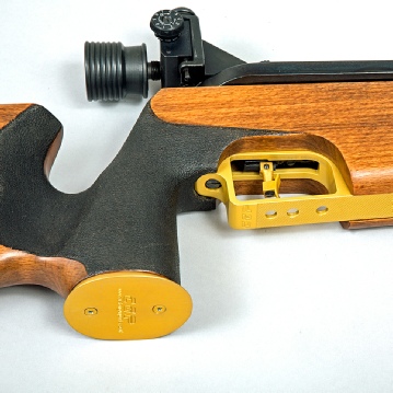 A custom Gun Parts gold anodised pistol grip cap fitted to a Feinwerkbau 300s match air rifle
